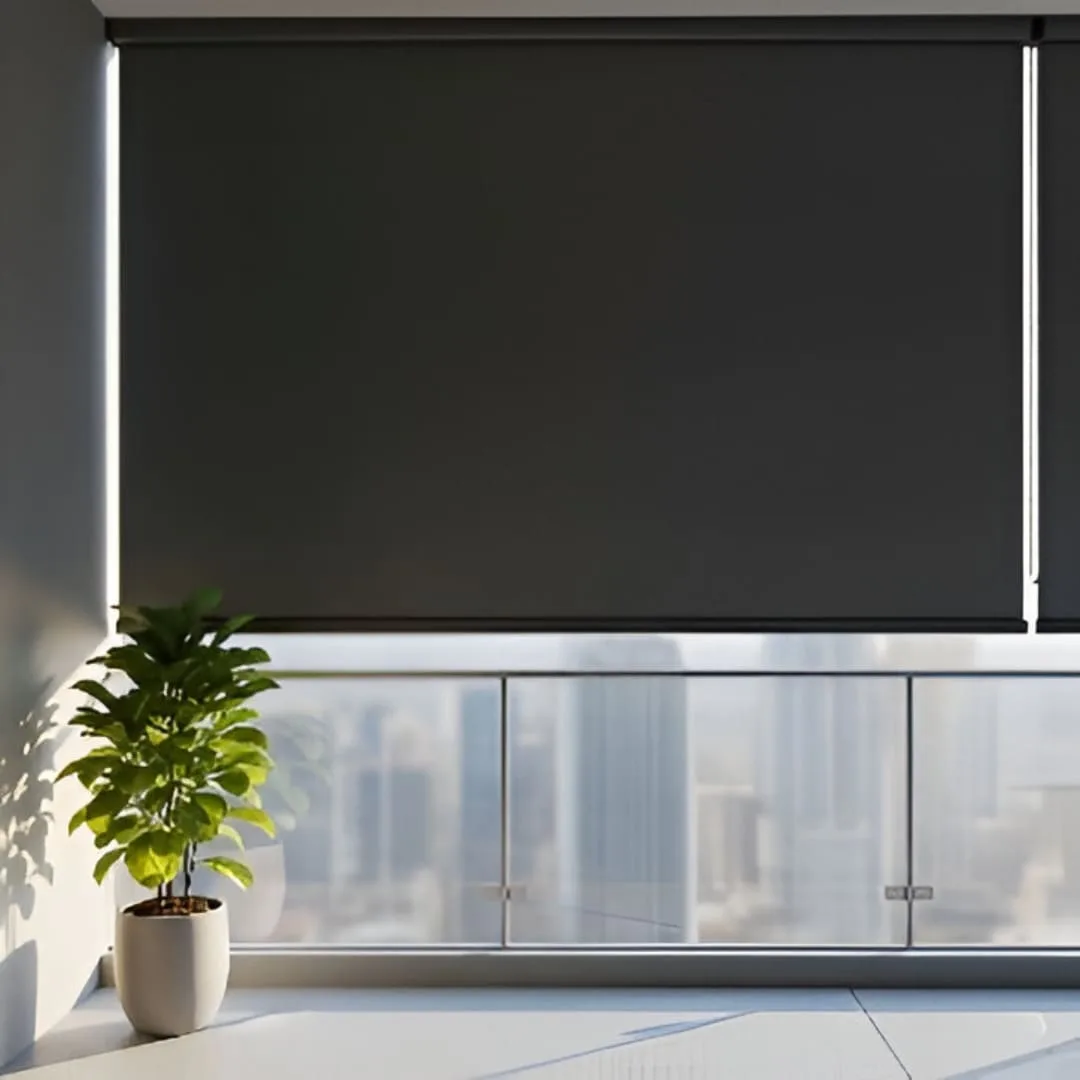 A close-up of a window with blackout PVC blinds fully closed, showing the opaque, matte black slats that interlock to block out all light.