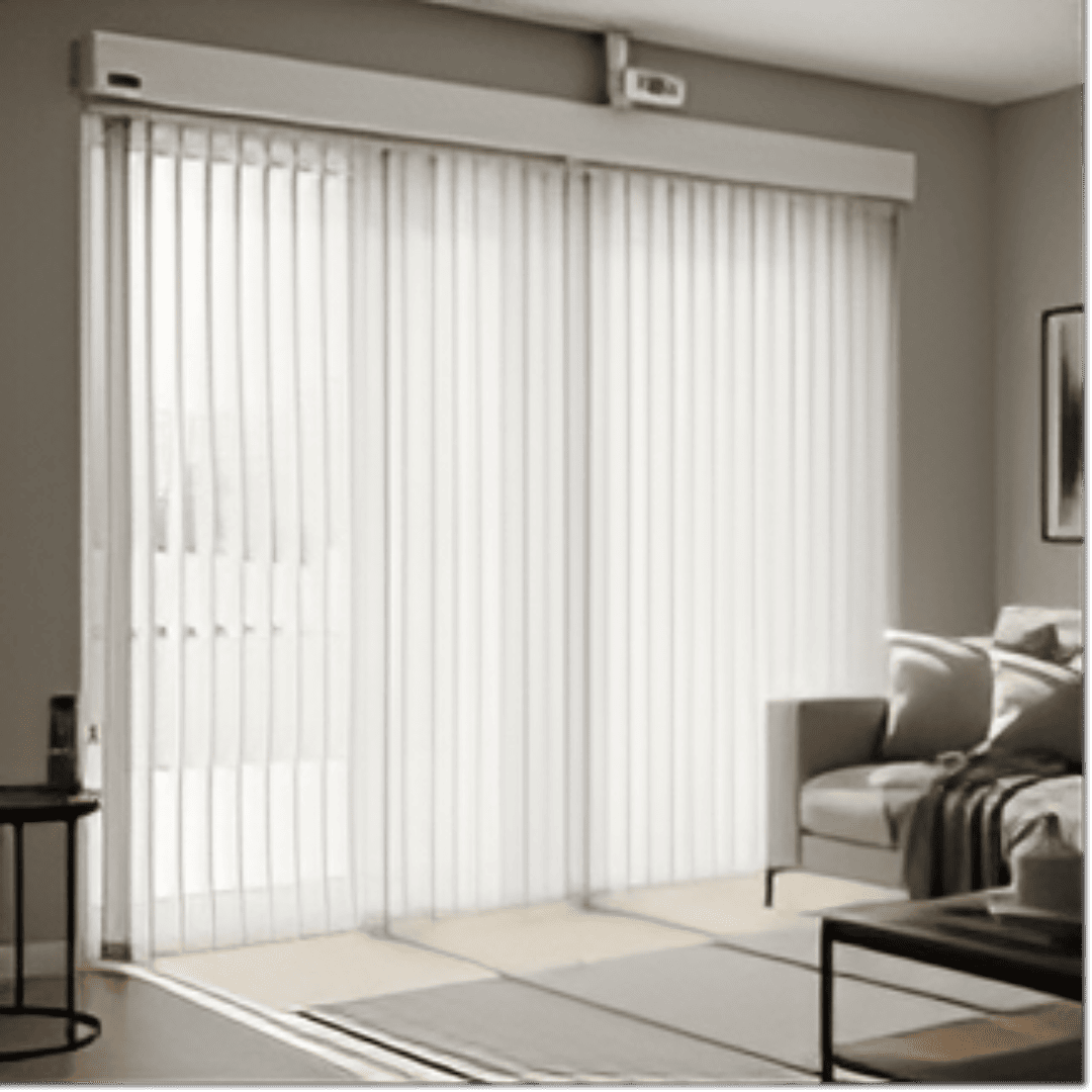 A set of motorised vertical blinds covering a large window in a modern living room. The blinds are off-white and neatly aligned, with a remote control visible on a nearby side table. 