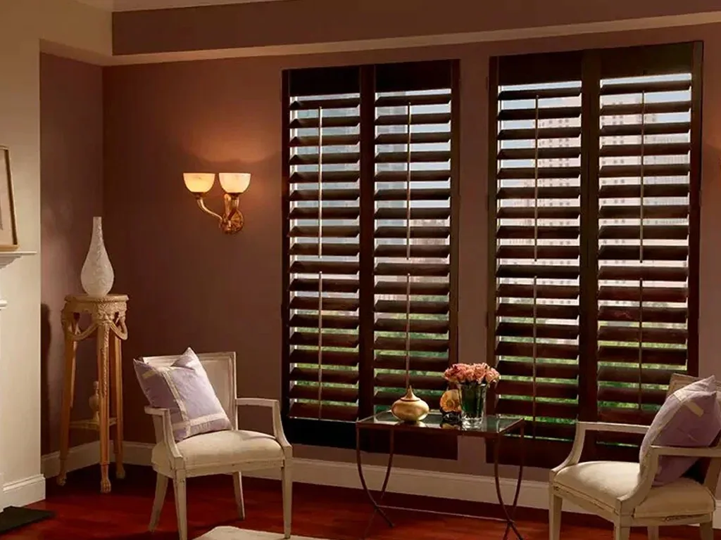 Natural wooden blinds partially open on a window in a Bengaluru home, adding warmth and an elegant natural look to the interior.