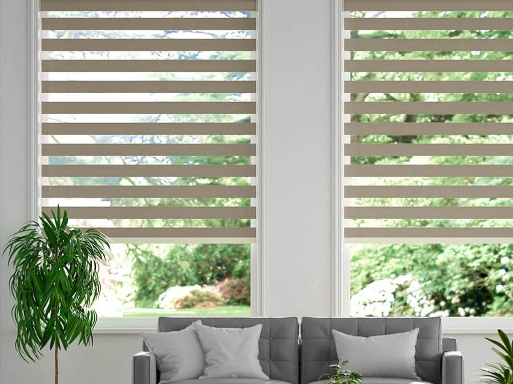 Dual layer zebra blinds featuring alternating sheer and opaque stripes on a window in a Bengaluru home, offering stylish light control.
